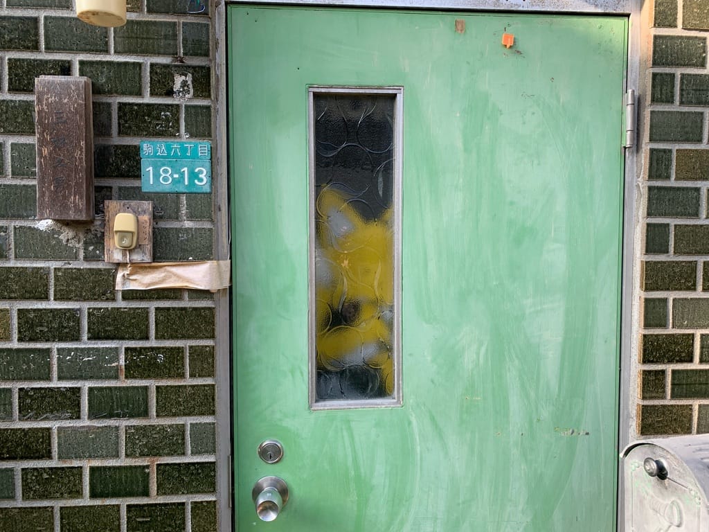 Stuffed animal through the opaque glass of a window.