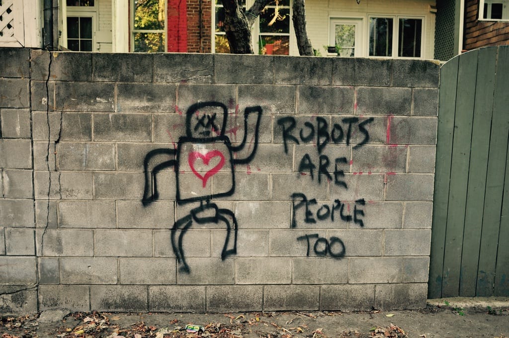 Graffiti of a robot on a wall.