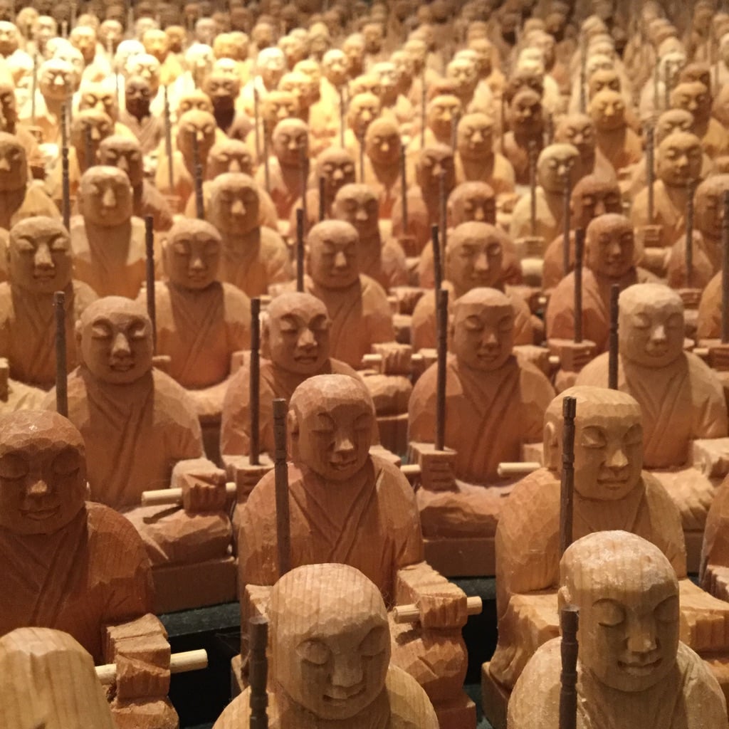 A lot of bouddha sculpted in wood, which looks very similar